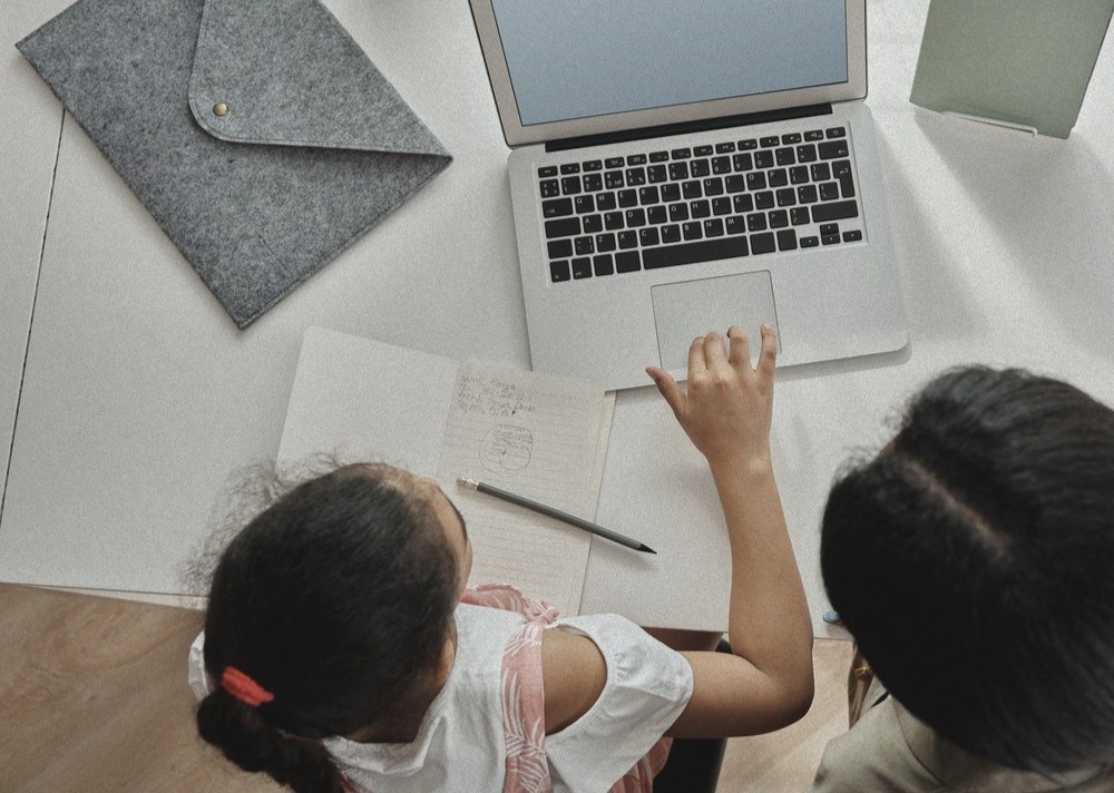 online school student working on laptop