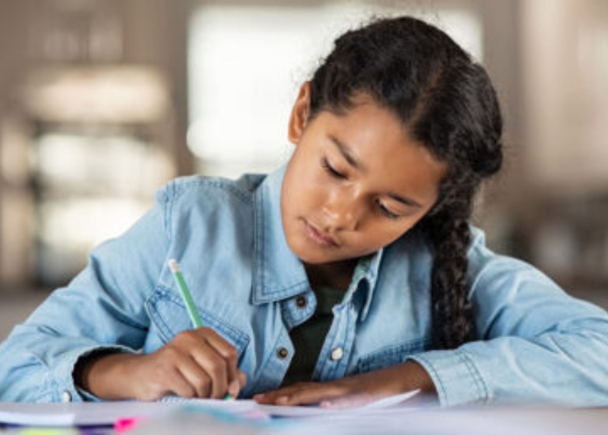 A young female student doing her school work