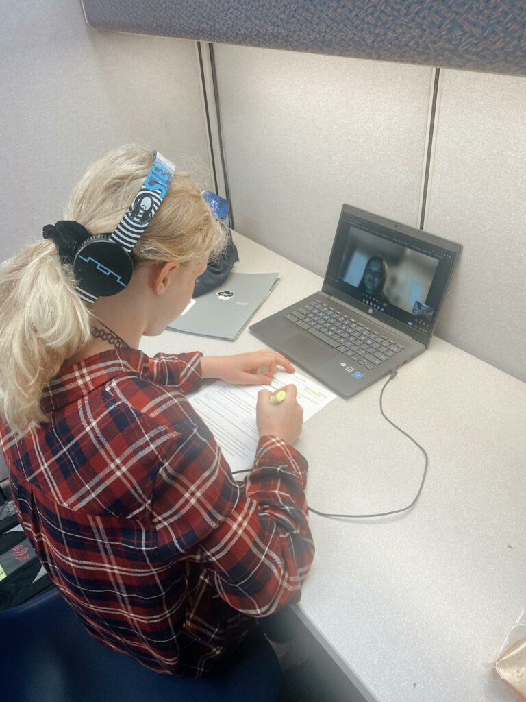 online student working at a desk in a learning lab